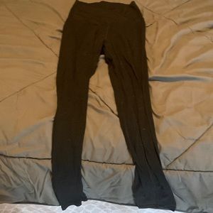 Black leggings with a cross around waist